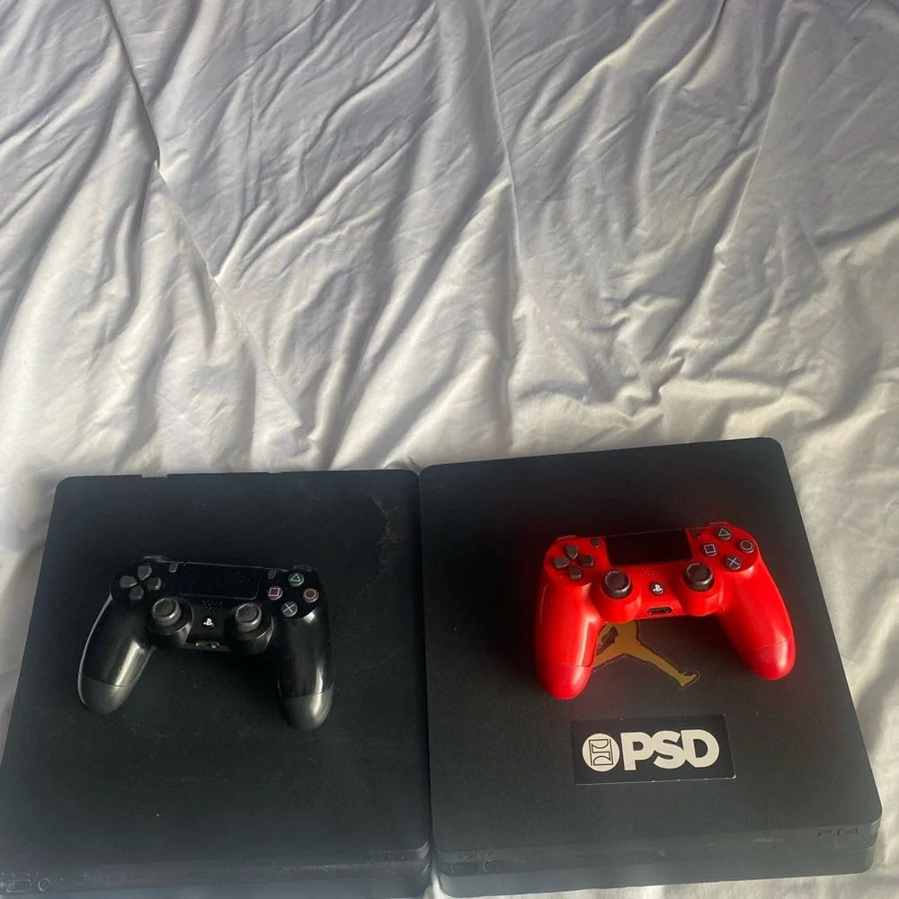 2 Sony Console with Black and Red Controllers